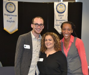 Three people smiling with each other.